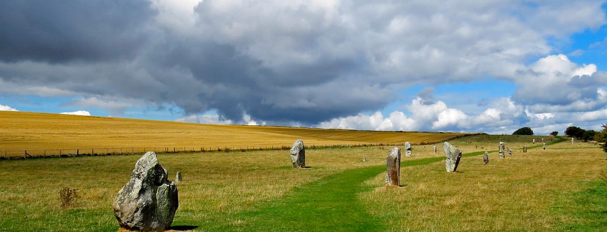 avebury beneath cloudy sky